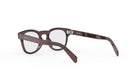 A pair of brown-framed glasses with the brand name "Celine PA" visible on the temples.