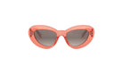 A pair of red, cat-eye-shaped sunglasses with dark lenses.