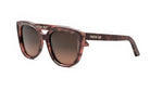 A pair of brown cat-eye sunglasses with the brand name "CHRISTIAN DOR" printed on the frame.