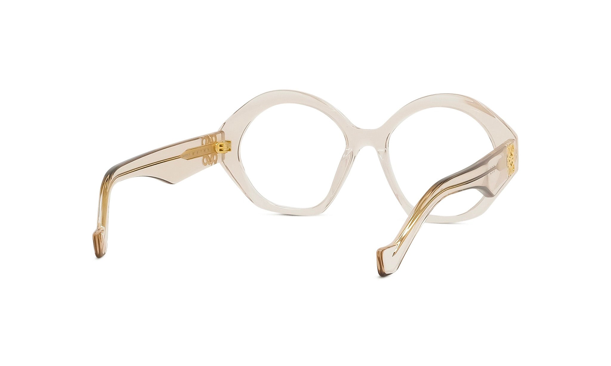 A pair of round, clear eyeglasses with gold-colored metal accents.
