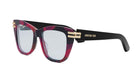 A pair of stylish, red-framed sunglasses with gold accents, featuring the Christian Dior logo on the frame.