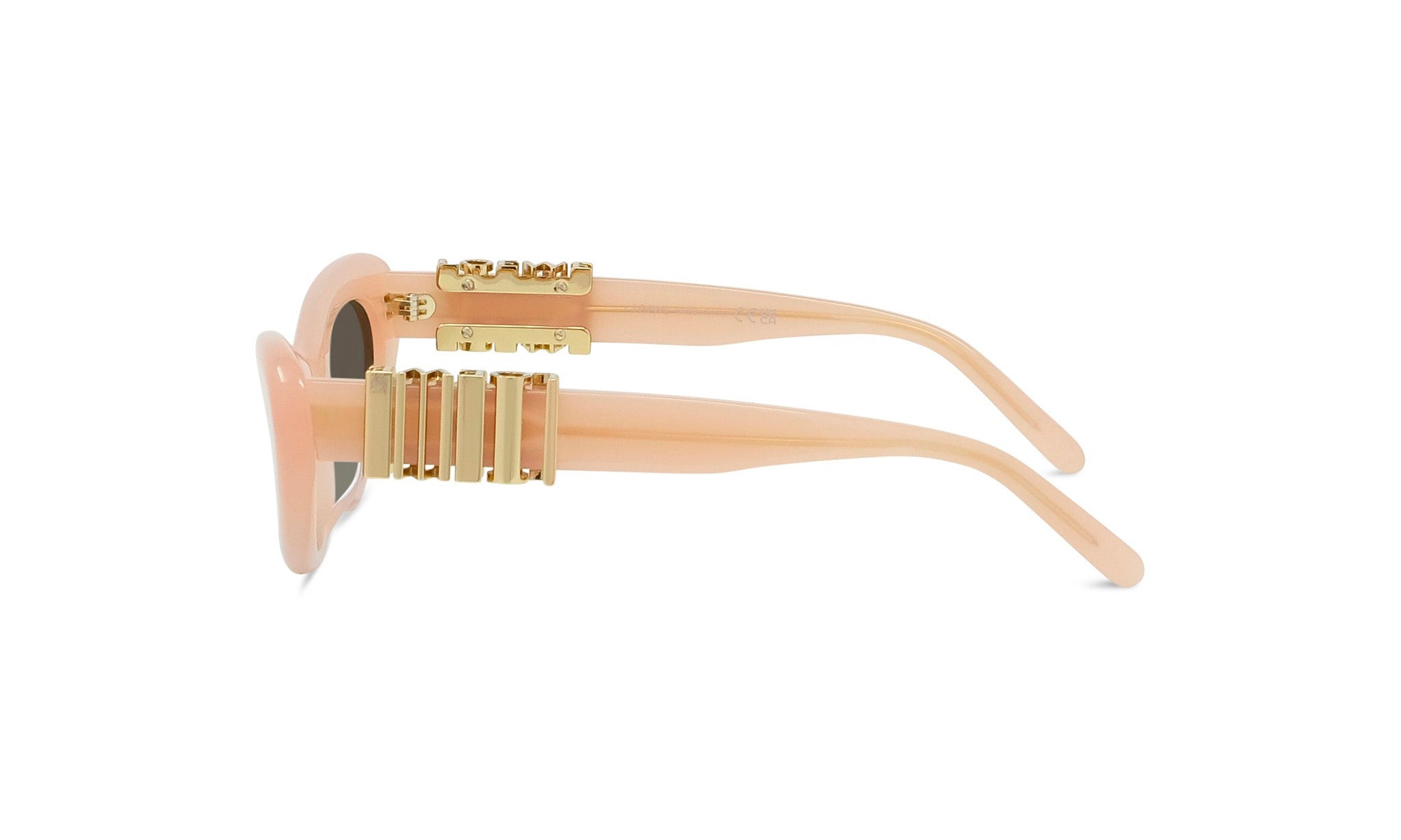 A pair of peach-colored sunglasses with gold-colored metal accents.