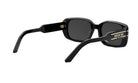 A pair of black sunglasses with gold accents, featuring the Christian Dior logo on the temples.
