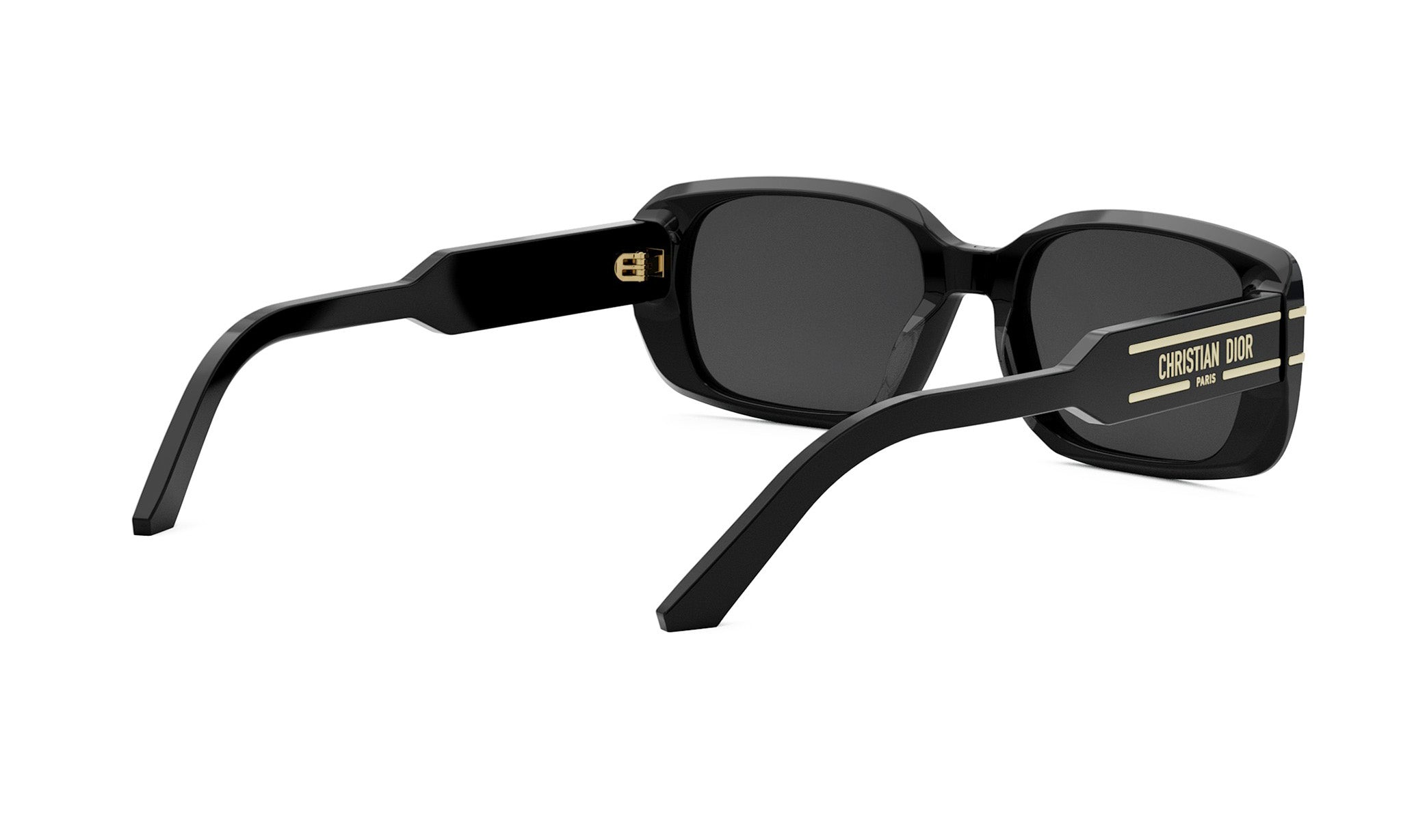 A pair of black sunglasses with gold accents, featuring the Christian Dior logo on the temples.