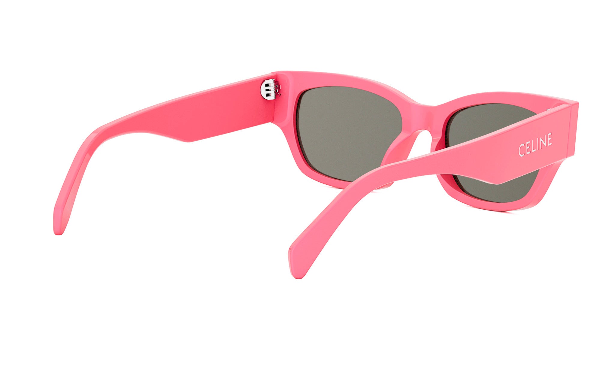 A pair of pink sunglasses with the Celine logo on the frame.