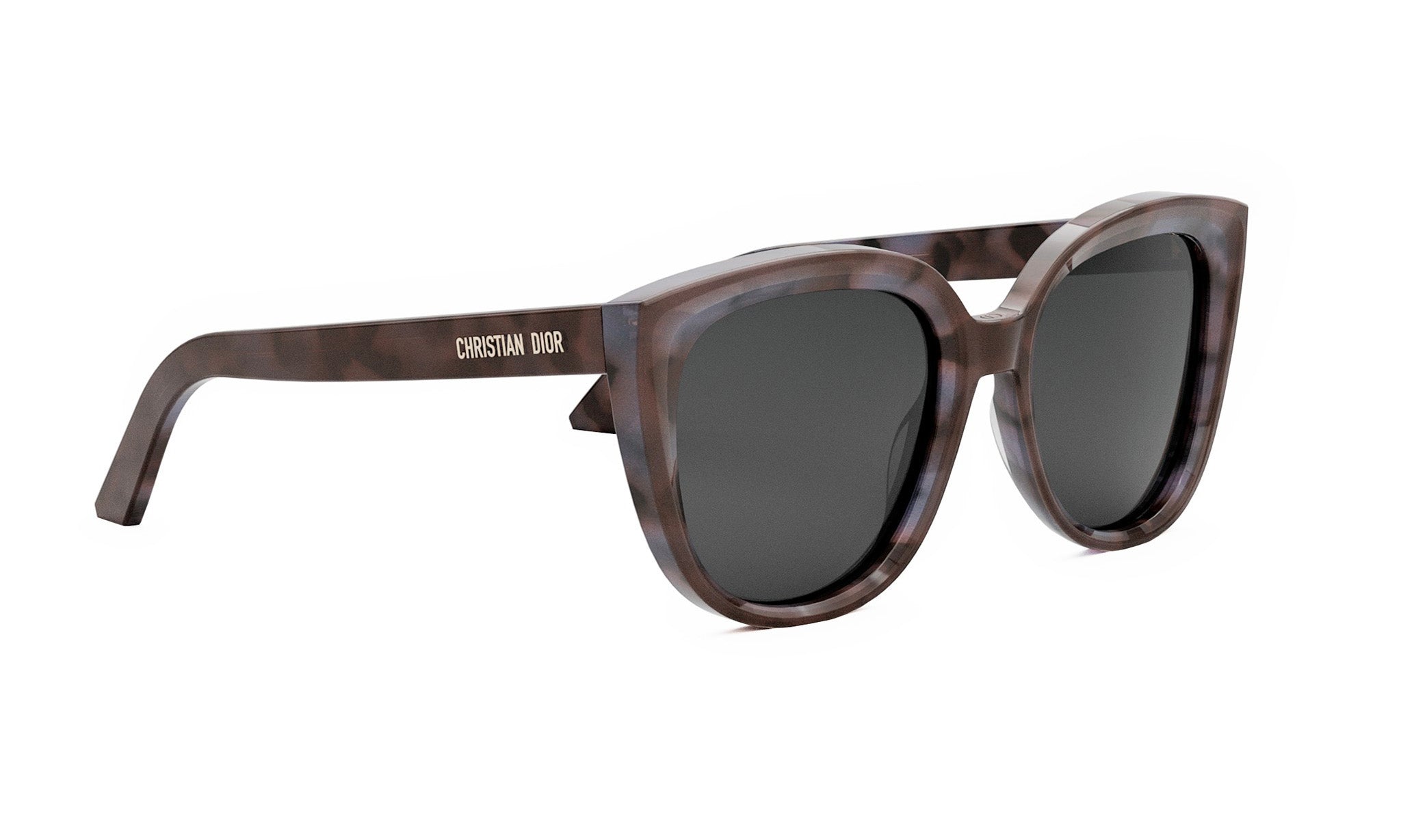 A pair of brown cat-eye sunglasses with the brand name "Christian Dior" printed on the frame.