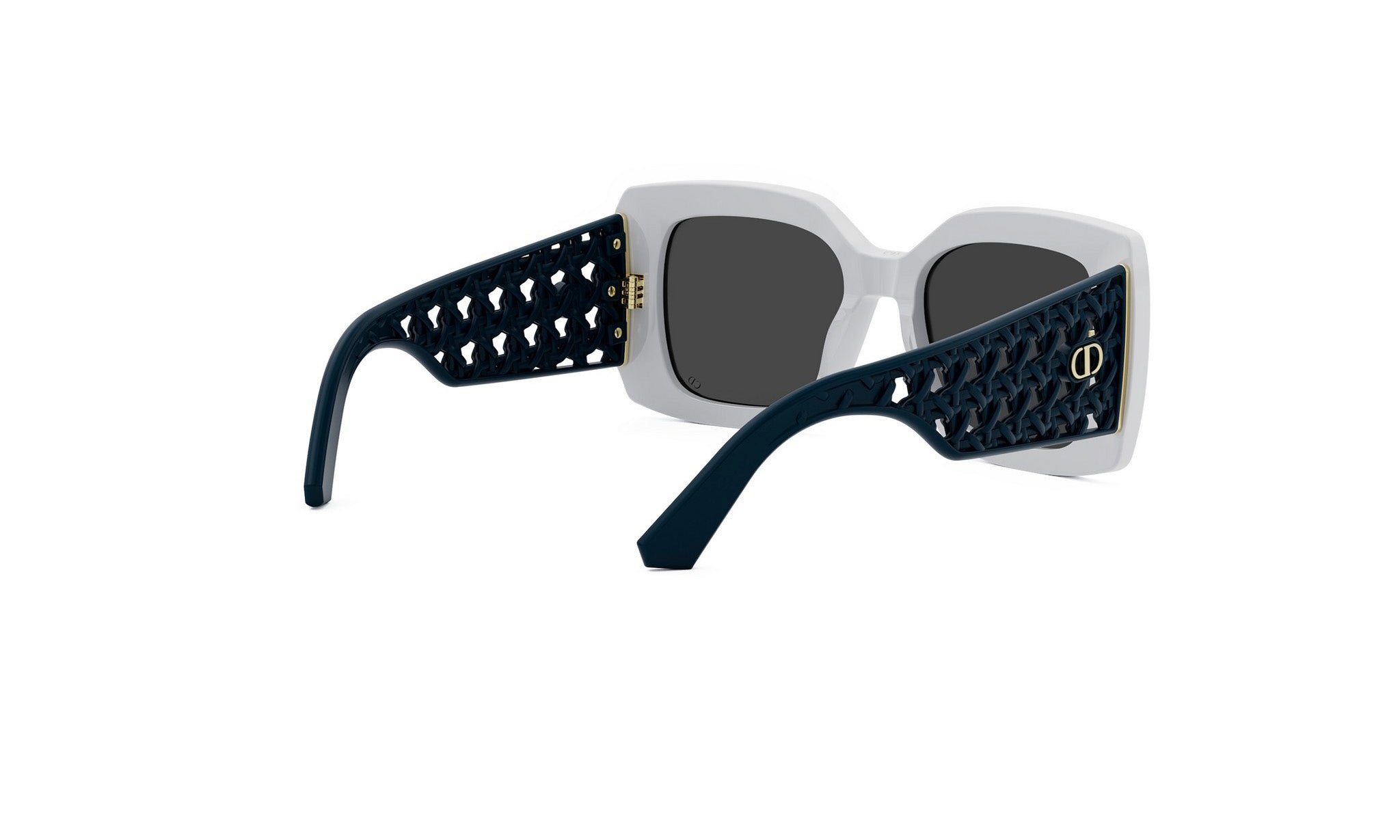A pair of stylish sunglasses with a white frame and black perforated pattern on the sides.