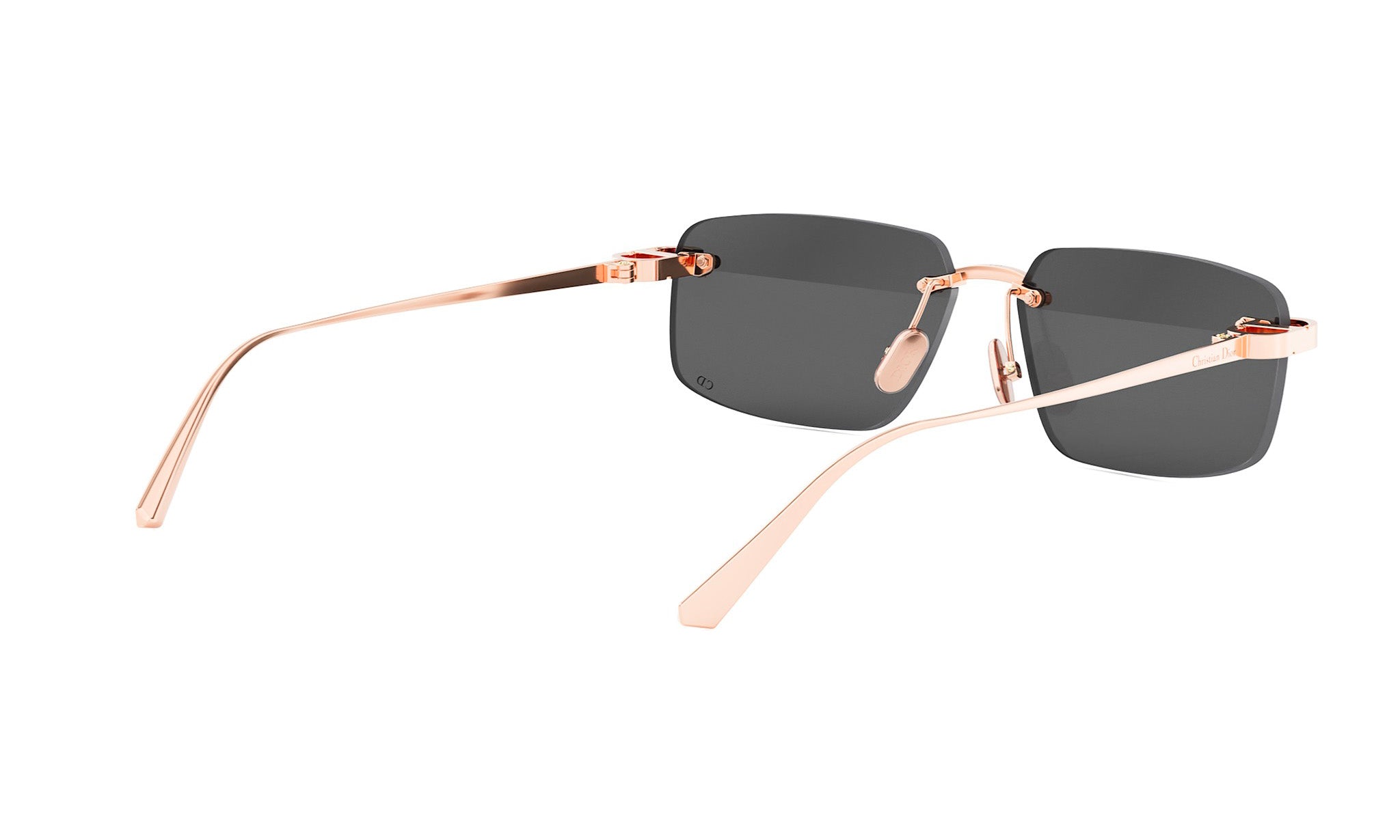 A pair of stylish sunglasses with gold-colored frames and dark lenses.