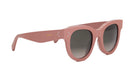 A pair of pink sunglasses with a dark lens.
