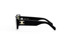 A pair of black sunglasses with a gold logo on the frame.