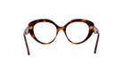 A pair of tortoiseshell-framed glasses with a dark tortoiseshell frame and a lighter tortoiseshell center.