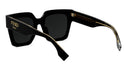 A pair of black sunglasses with gold accents, featuring the Fendi logo on the frame.