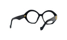A pair of black, round-framed glasses with gold accents.