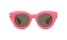 A pair of pink sunglasses with dark lenses.