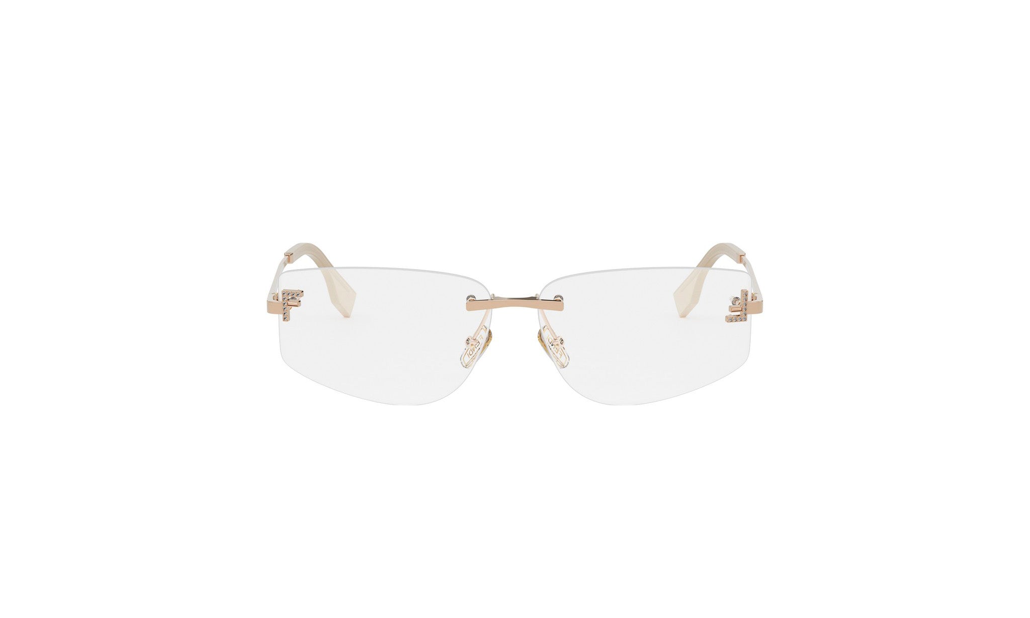 A pair of clear rimmed glasses with gold-colored metal frames.