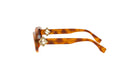 A pair of brown sunglasses with gold accents, featuring a distinctive design.