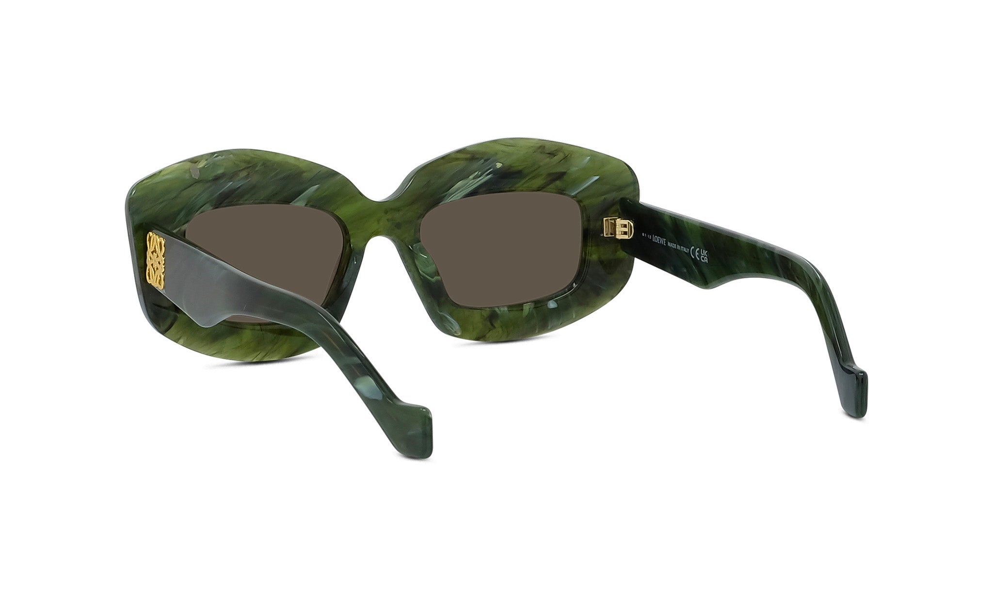 A pair of green-tinted sunglasses with gold accents, featuring a unique, avant-garde design.