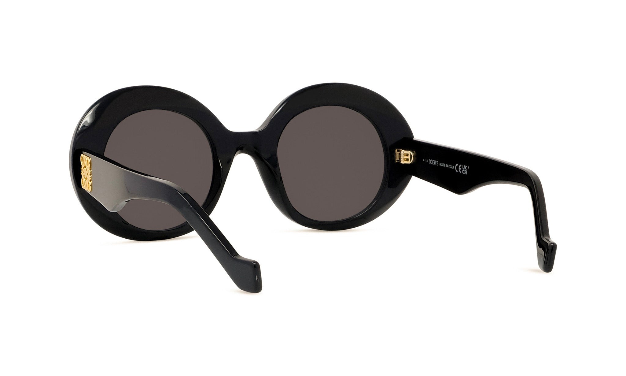 A pair of black, round sunglasses with gold accents.
