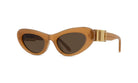 A pair of tan-colored cat-eye sunglasses with a gold-colored frame.