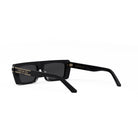 A pair of black sunglasses with gold text on the frame.