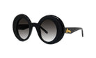 A pair of black round sunglasses with a gold logo on the frame.