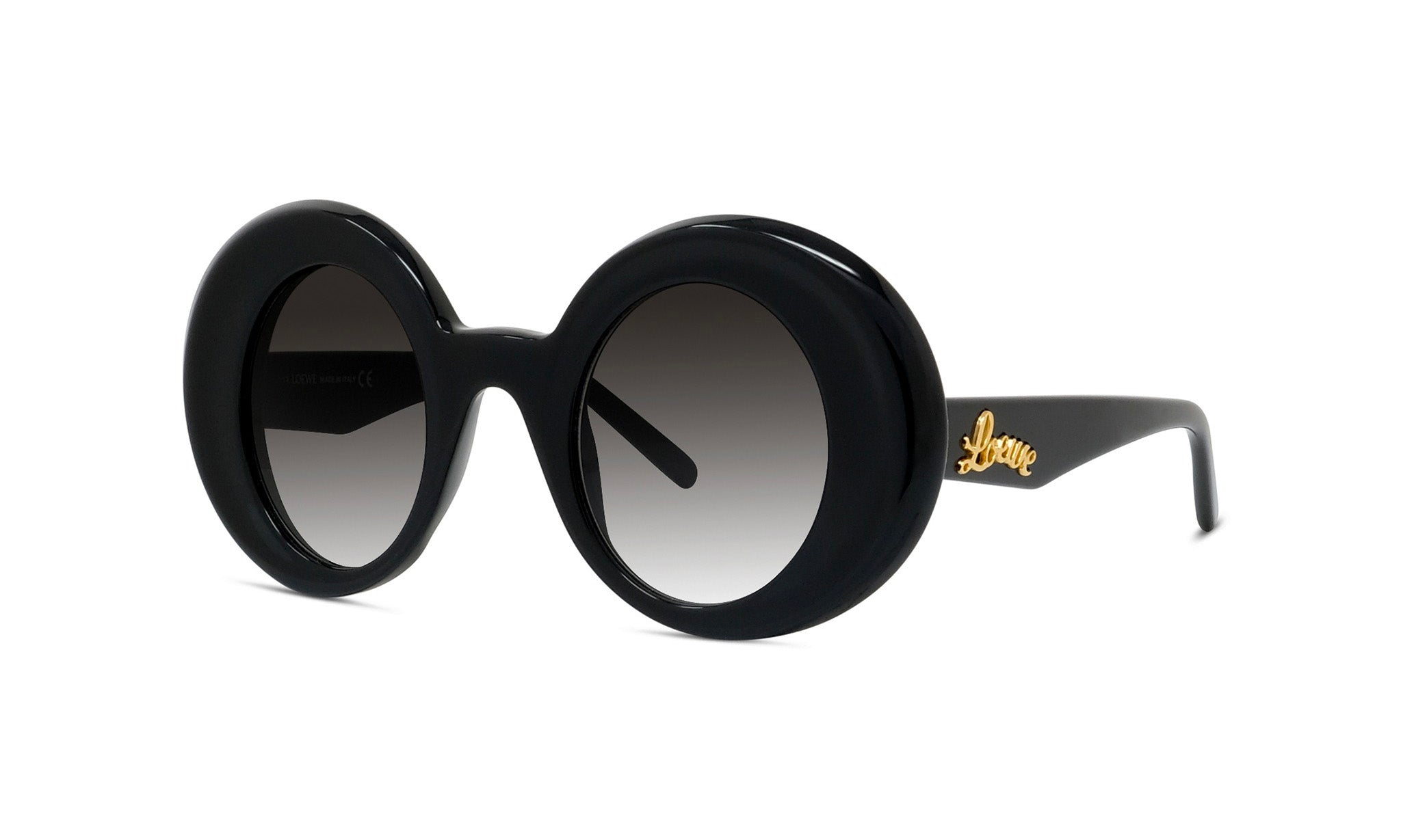 A pair of black round sunglasses with a gold logo on the frame.