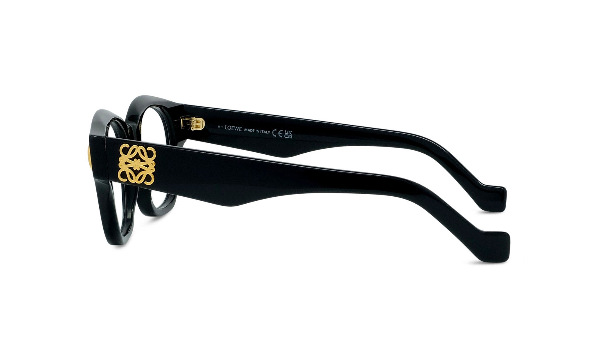 A pair of black-framed glasses with a gold logo on the temples.