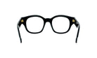A pair of black-framed glasses with gold-colored temples.