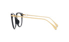 A pair of black-framed glasses with gold-colored arms and temples.