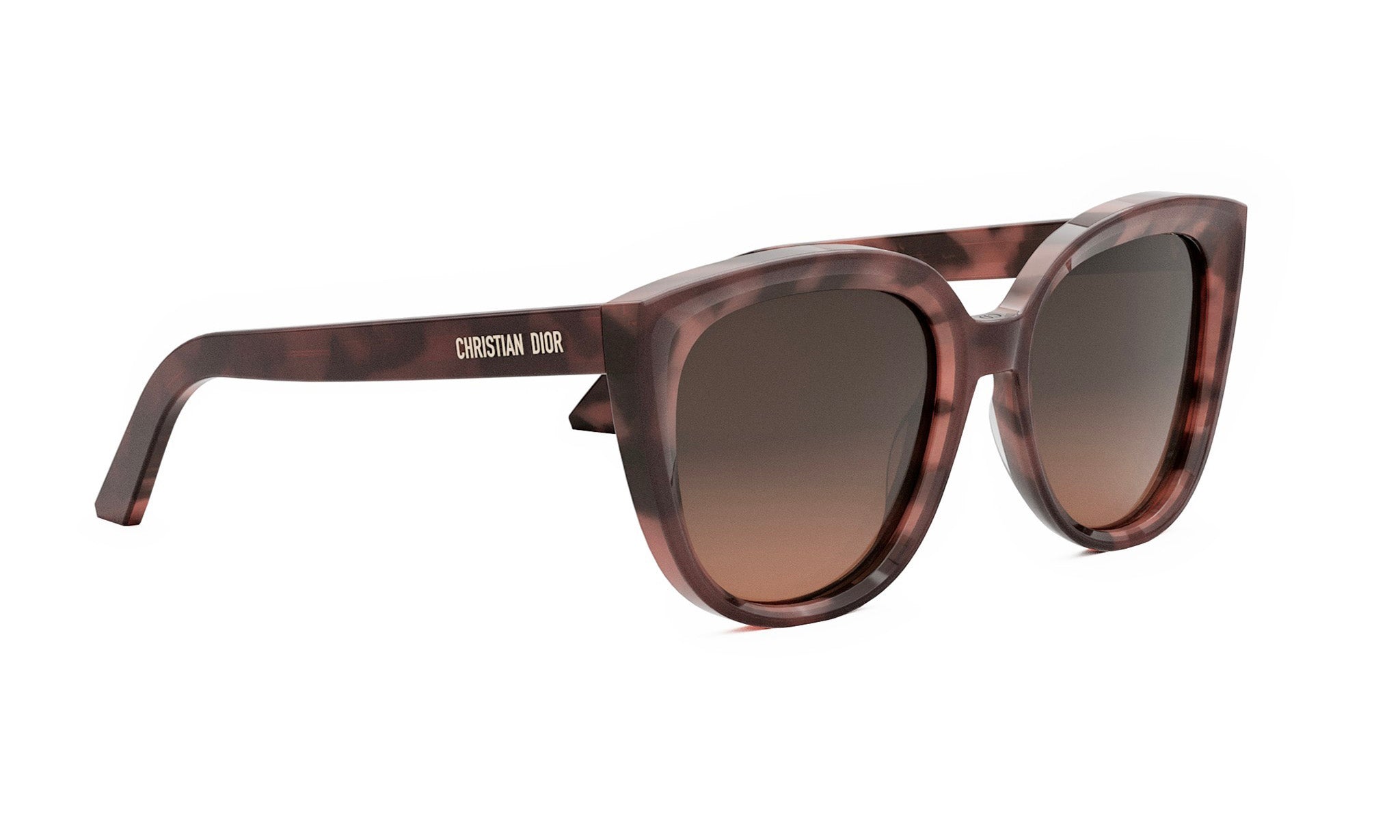 A pair of brown cat-eye sunglasses with the brand name "CHRISTIAN DIOR" printed on the frame.